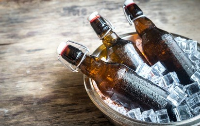 bottles of beer in ice cubes