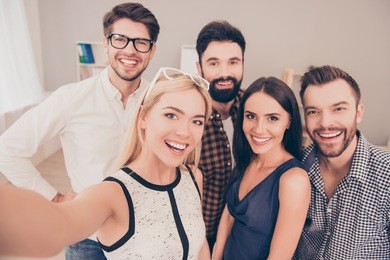 happy young successful group of businesspeople   make selfie photo and smiling