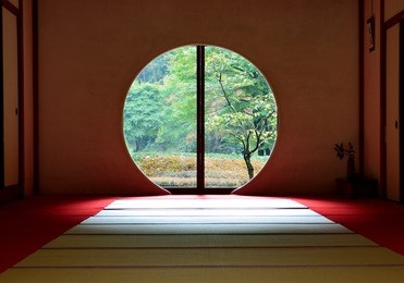 view from the round window at meigetsuin temple in early autumn, kamakura city, japan