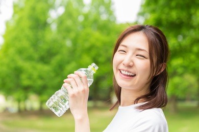 beautiful young asian woman who drinks water