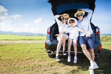 happy family enjoying road trip and summer vacation