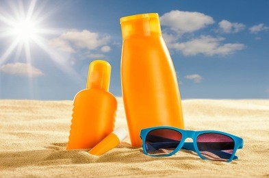 various sunsreen products in the sand