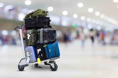 airport luggage trolley with suitcases
