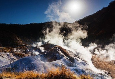 jigokudani or hell valley against sunrise and sky in noboribetsu, hokkaido, japan