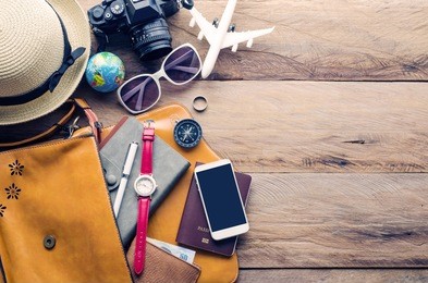 travel accessories and costume on wooden floor