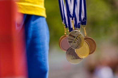 gold, silver and bronze with symbol of running athlete. nice wallpaper for summer olympic game in rio