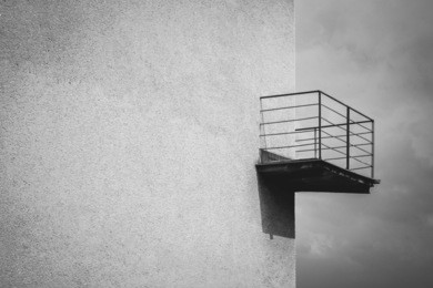 minimalist balcony on building seen from outside with no features