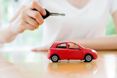 small car and key for car, car leasing and car loan concept