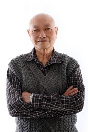 elderly asian man standing against white background