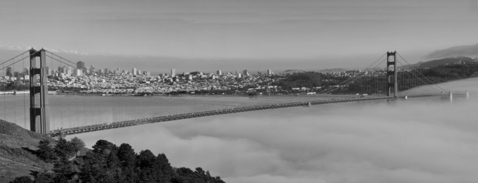 photo panoramic of san francisco golden gate bridge in black and white. beautiful panorama from san francsico city skyline with golden gate bridge in black and white format.