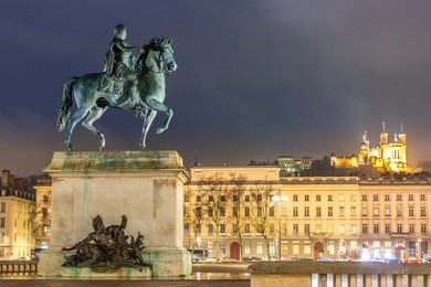 lyon place bellecour statue of king louis xiv at night france