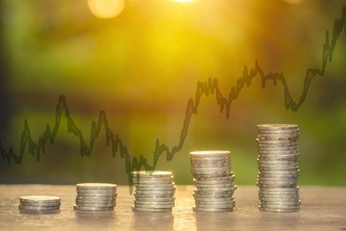 double exposure. investment concept. money coin and stock chart.