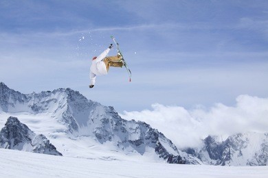 ski rider jumping on mountains. extreme ski freeride sport.