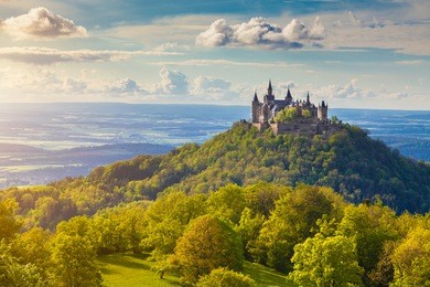 aerial view of famous hohenzollern castle, ancestral seat of the imperial house of hohenzollern and one of europe's most visited castles, in beautiful golden evening light, baden-wurttemberg, germany