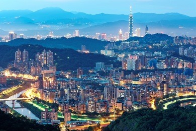 aerial panorama of overpopulated suburban communities in taipei at dusk, with taipei 101 tower in downtown, bridges over xindian river & distant mountain silhouettes ~ romantic taipei in blue twilight
