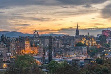 edinburgh city in sunset view, edinburgh city from calton hill at sunset time, edinburgh castle as background, city lights from edinburgh city