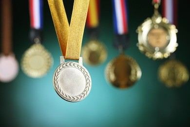 selective focus on the medal in front of blackboard