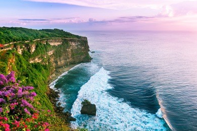 view of uluwatu cliff with pavilion and blue sea in bali, indonesia