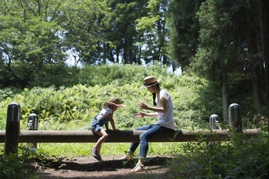 mother and daughter playing in the park