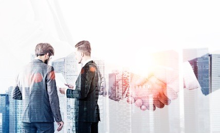 partnership concept with businesspeople discussing and shaking hands on singapore city background. double exposure