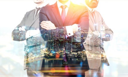 teamwork and partnership concept with businesspeople crossing arms on illuminated singapore city background at night. double exposure