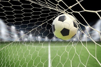 soccer ball in goal with spotlight