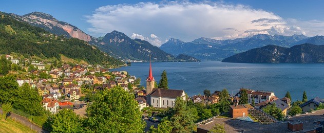 beautiful mountain scenery with the town of weggis at the northern shore of lake lucerne in beautiful evening light at sunset, canton of lucerne, central switzerland