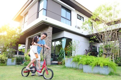 healthy father and daughter playing together outside their new house. home fun  lifestyle, family concept.