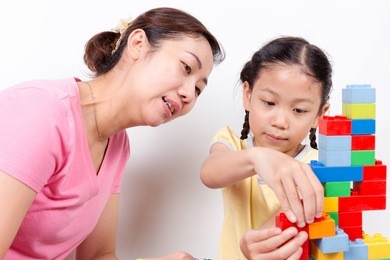 mother and child daughter playing together