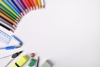 student material on white table to the left of the frame with place for title. top view