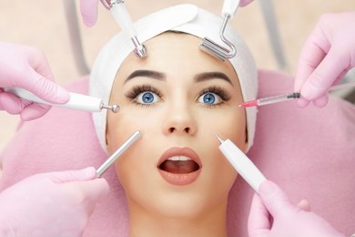 conceptual beauty and cosmetology image of the hands of several beauticians holding their respective equipment. beauty concept. cosmetology concept. cosmetology salon. cosmetic procedures mesotherapy