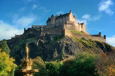 edinburgh castle with fountain as the famous city landmark. united kingdom.