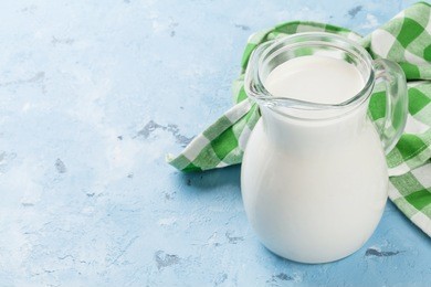 dairy products on stone table. milk jug. view with copy space