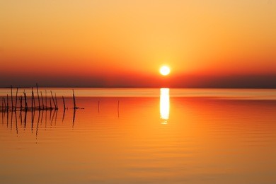 putting sun on the lake