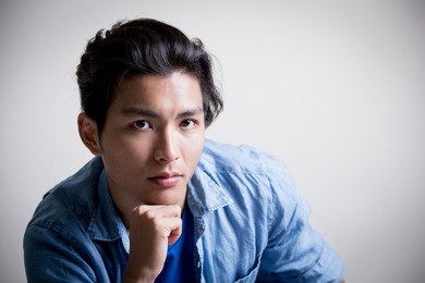 handsome man wear denim shirt and look serious,isolated white background,asian