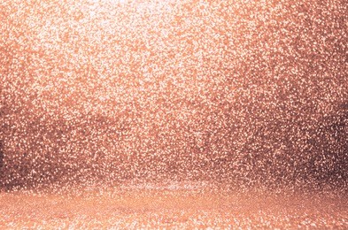 rose gold glitter, defocused abstract holidays lights on background.