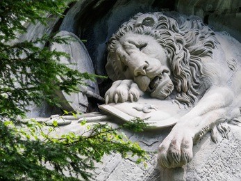 lewendenkmal, the lion monument landmark in lucerne, switzerland. it was carved on the cliff to honor the swiss guards of louis xvi of france.