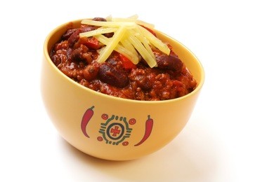 a bowl of home made chili, with beans and grated cheese.
