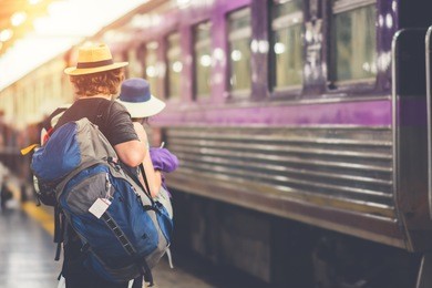 travelers are waiting for their train. outdoor adventure travel by train concept. location: bangkok, thailand. happy/positive/healthy hike/travel/wanderlust concept