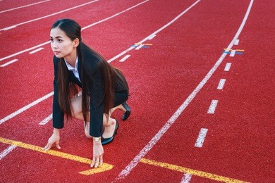asian business woman on running track