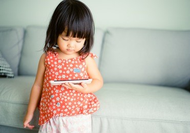 child girl happy look smart phone. asian child.child development.