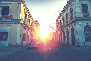 car drive in havana street, faded and  filtered vintage photo effect