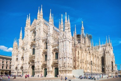daytime view of famous milan cathedral (duomo di milano) on piazza in milan, italy 