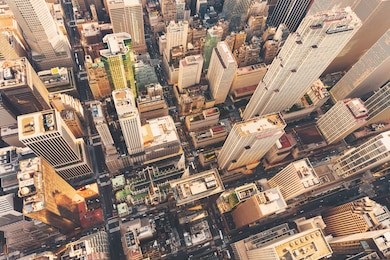 aerial view of midtown manhattan at sunset with a view of st patrick's cathedral