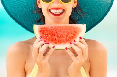 fun beach summer holiday concept.  woman holding watermelon on the beach. 