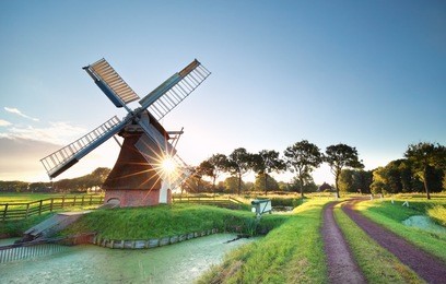 morning sunshine behind dutch windmill, holland