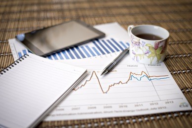 charts of growth on wood background , workplace businessman