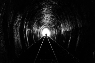 shadow of man standing in the train tunnel