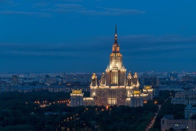 moscow state university - one of stalin skyscrapers at summer night in moscow, russia