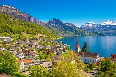 village weggis, lake lucerne (vierwaldstatersee), pilatus mountain and swiss alps in the background near famous lucerne (luzern) city, switzerland